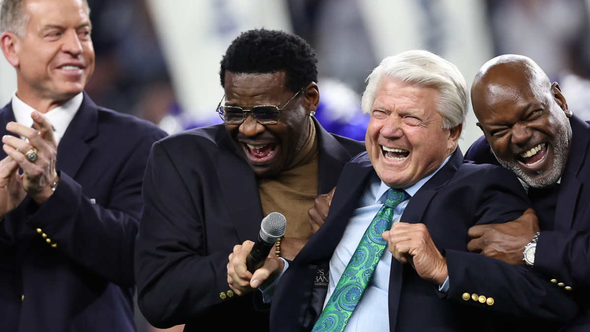 Cowboys Troy Aikman, Michael Irvin and Emmitt Smith flank former coach Jimmy Johnson